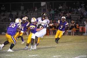 (Photo by Johnny Autery) Bulldog RB R.J. Rogers races to the outside for 1st down yardage against the Tigers. 
