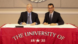 UWA President Ken Tucker (left) and Learning House President Todd Zipper (right) sign the seven-year agreement partnering UWA with the Learning House for enrollment management and enhanced marketing efforts for UWA Online. (WAW | Contributed)