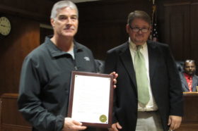 Webb Tutt, left, accepts a resolution from Marengo County Commissioner asdfaasdf