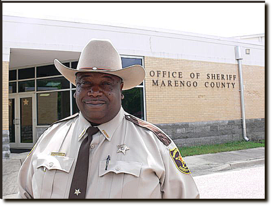 Marengo County Sheriff Richard Bates stands in front of the county jail in Linden, Ala.